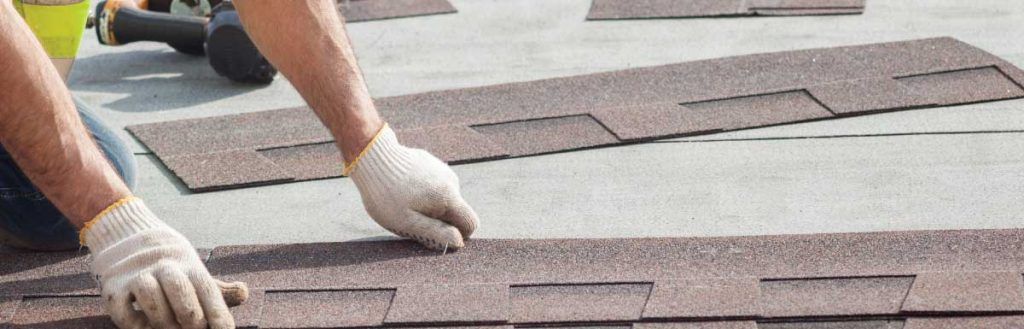 roofer installing residential roof shingles