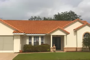 Home With Stucco Siding and a clay tile roof