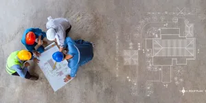 Aerial view of roofing contractors and homeowner reviewing roof replacement plans and Florida Building Code compliance requirements on construction site